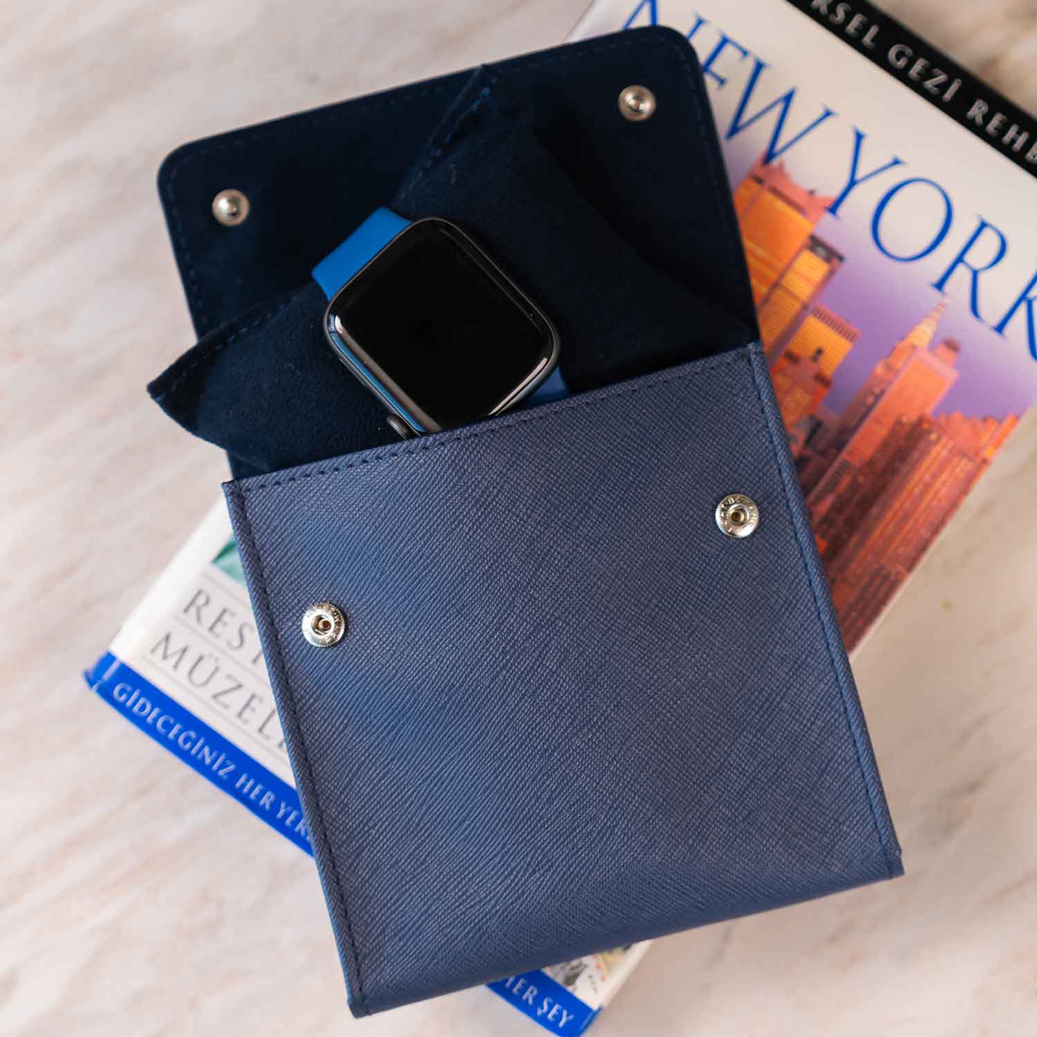 Chic dark blue vegan leather single watch case with polished modern flair.