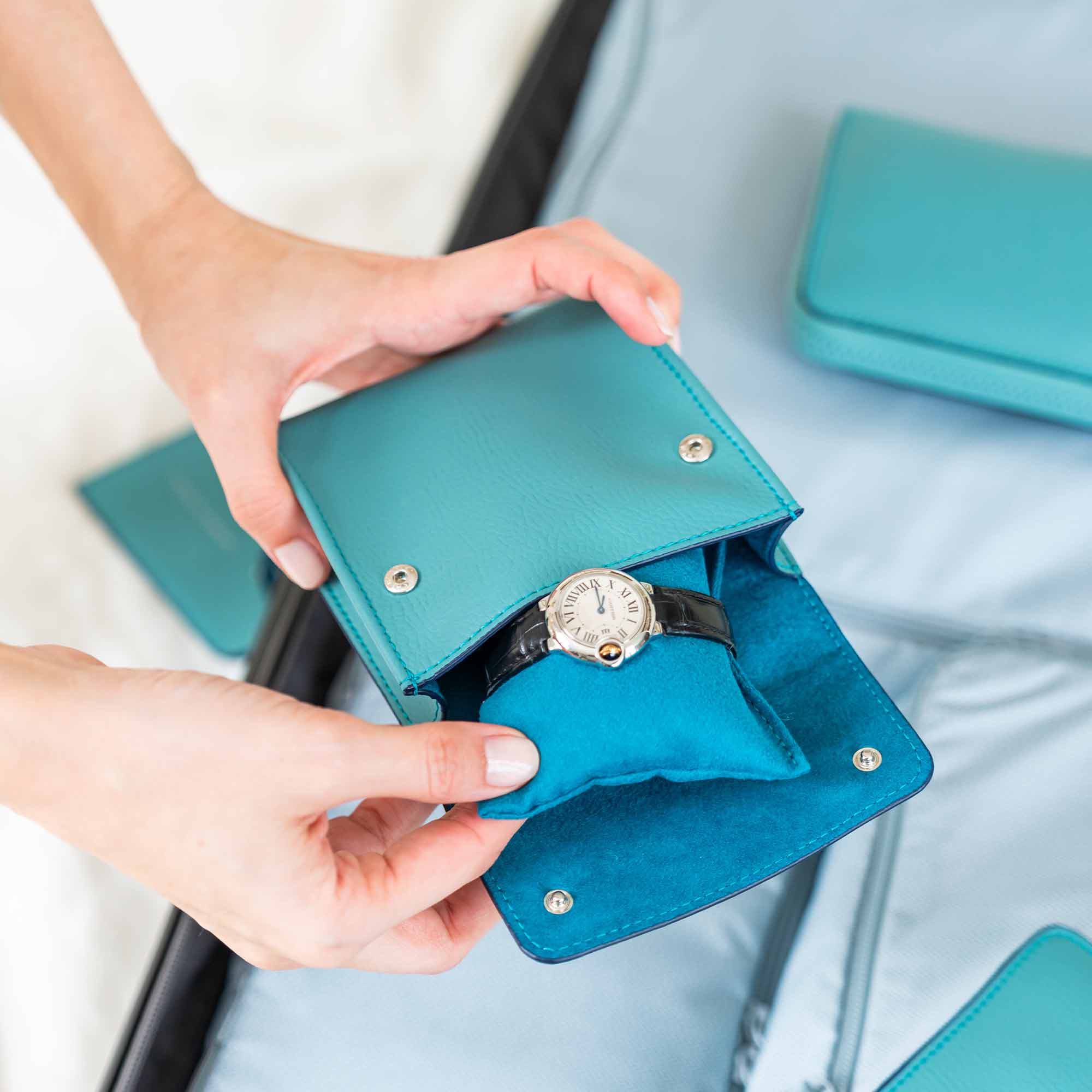 Chic turquoise vegan leather single watch case for bright, trendy appeal.