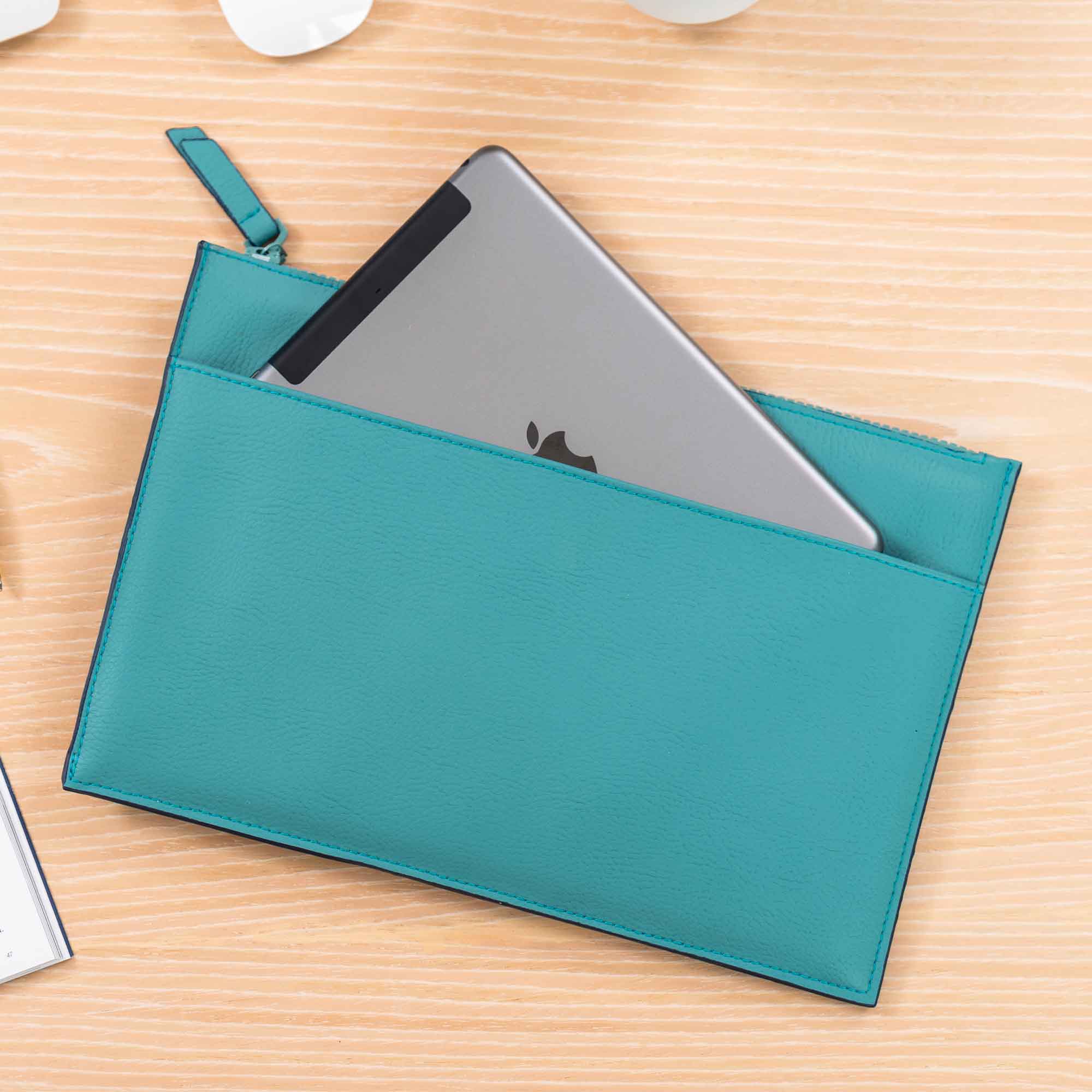 Durable turquoise vegan leather clutch for eco-style that lasts.