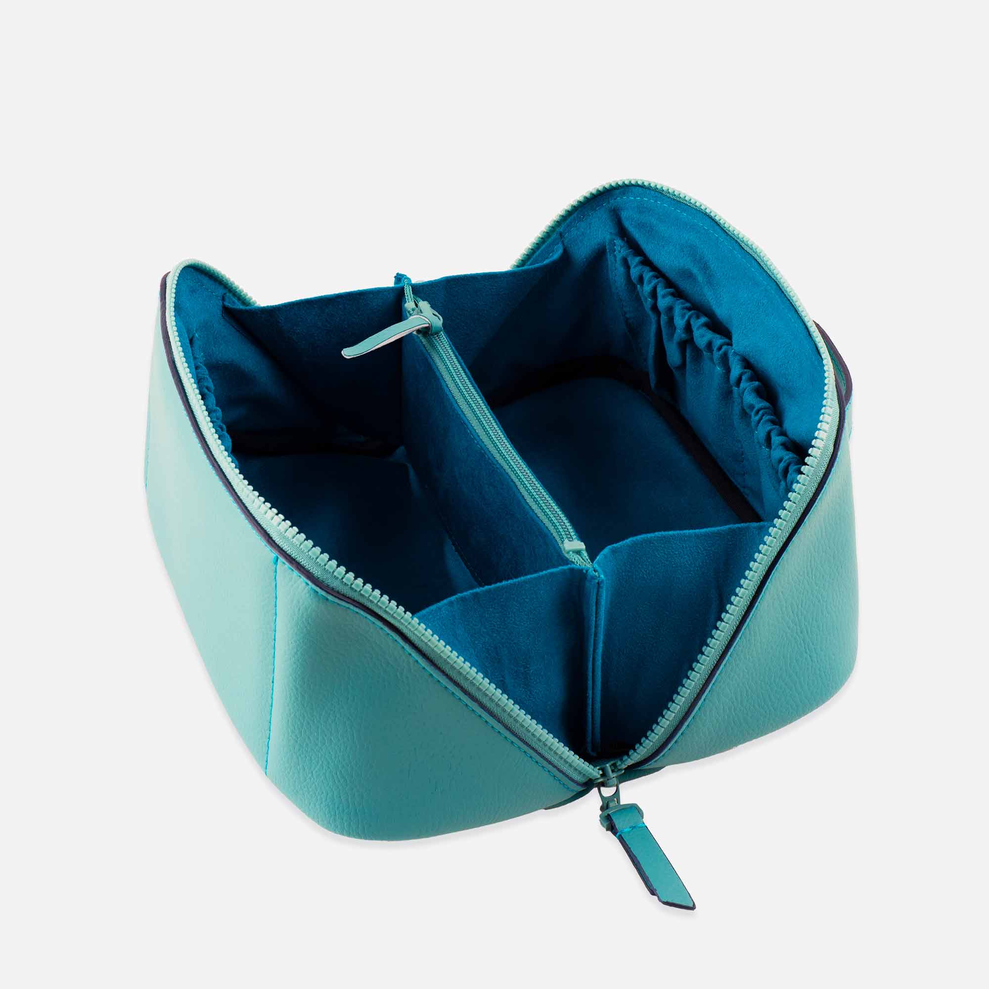 Durable turquoise vegan leather make-up bag built for beauty on-the-go.