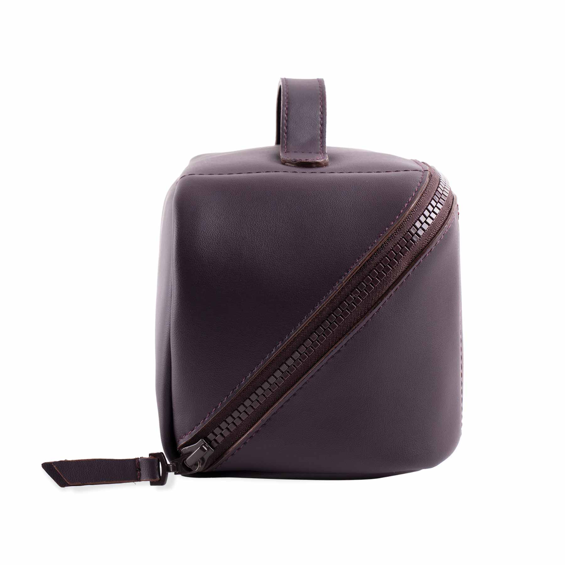 Elegant deep plum vegan leather make-up bag with graceful modern touches.