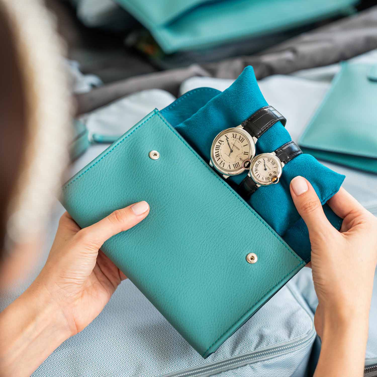 Practical turquoise vegan leather double watch case made for sleek functionality.