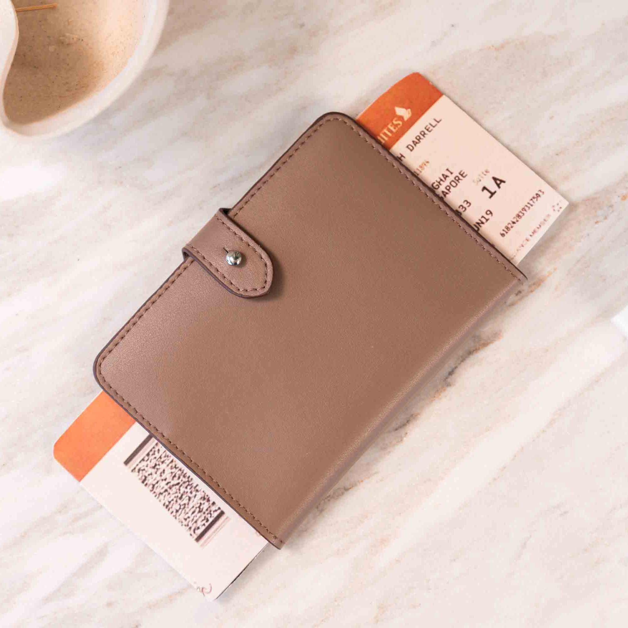 Quality beige vegan leather passport holder crafted for secure, elegant travels.