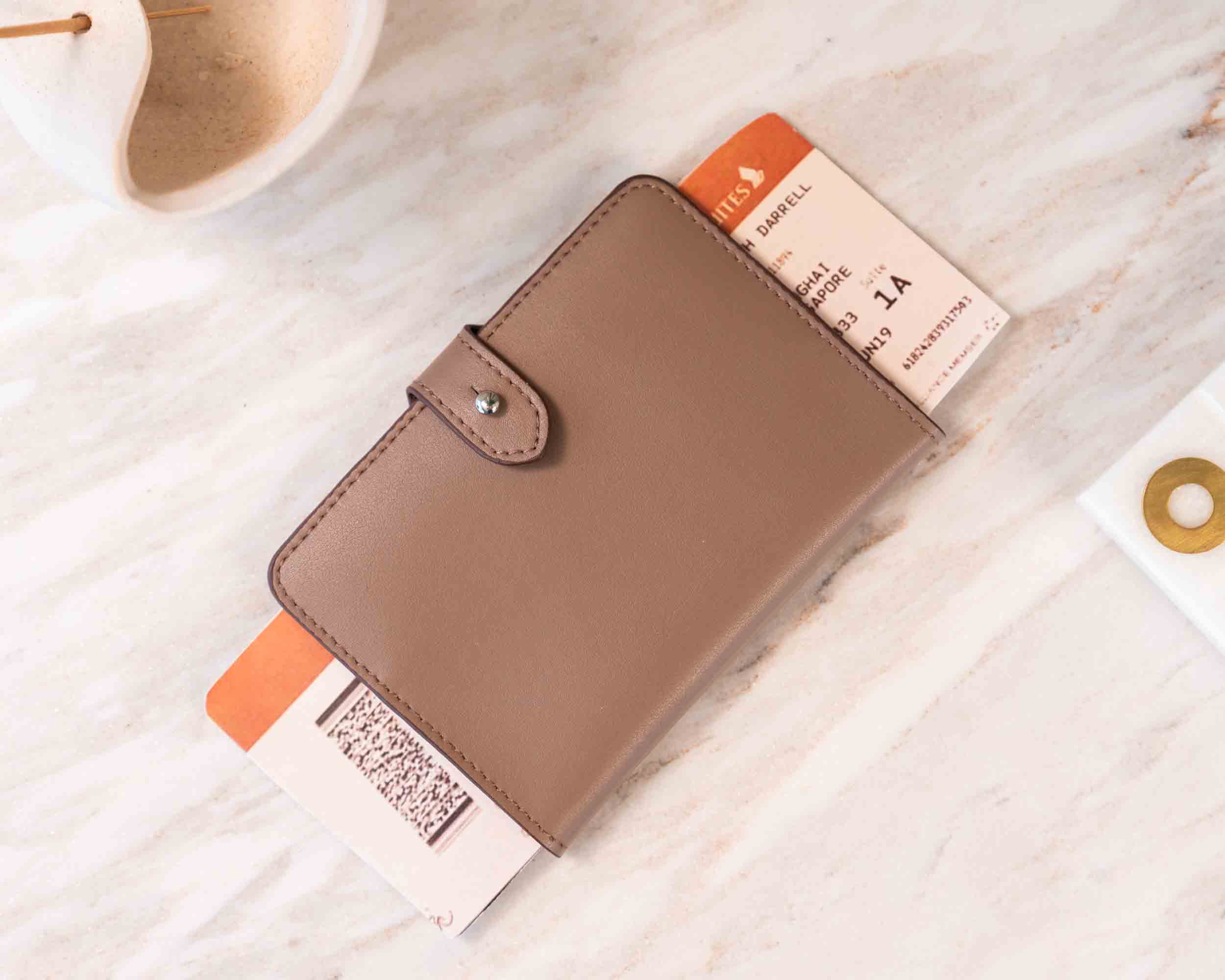 Quality vegan leather passport holder and beige luggage tag for travel in style.