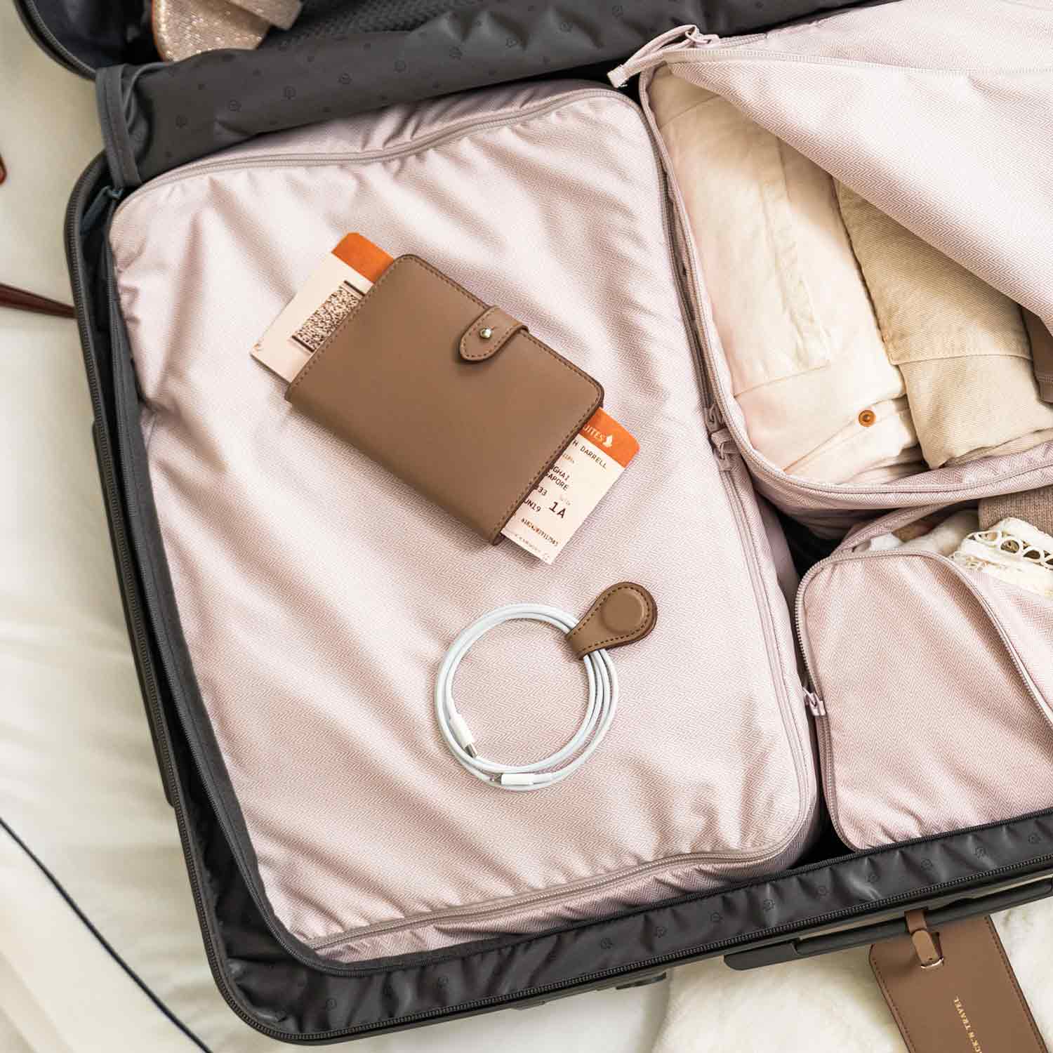 Stylish beige vegan leather cable tie for organising cords with eco-friendly elegance.