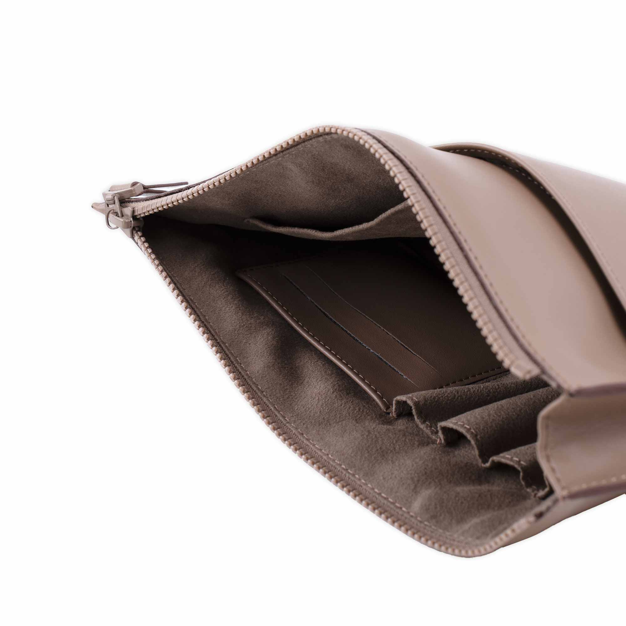 Stylish beige vegan leather clutch perfect for both day and night outfits.