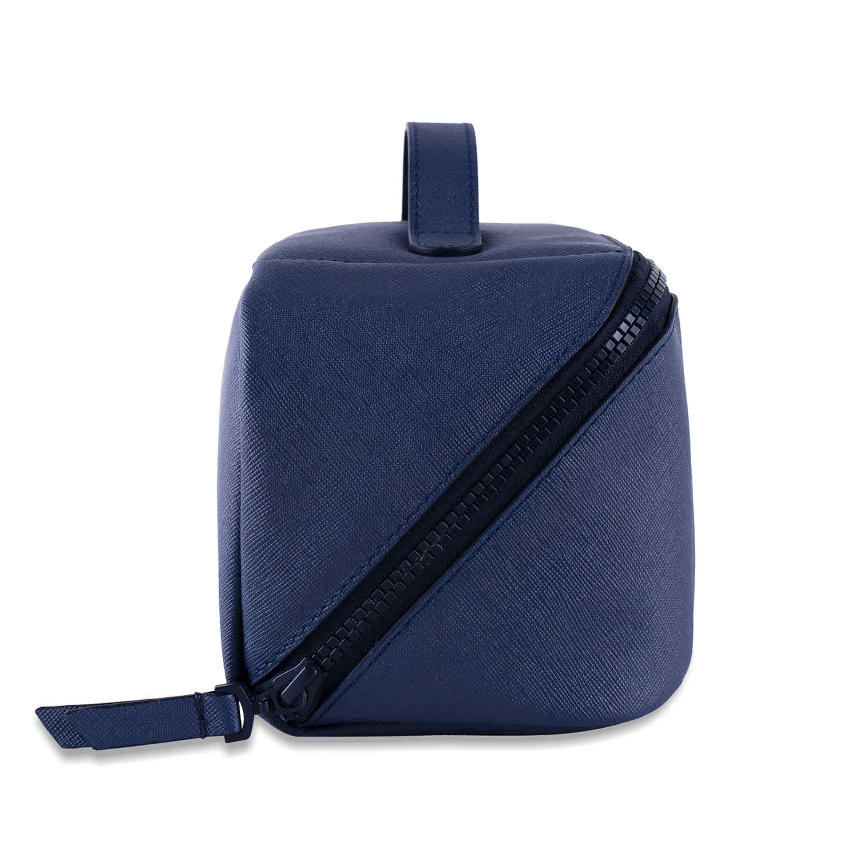 Stylish dark blue vegan leather make-up bag with minimalist, modern design.