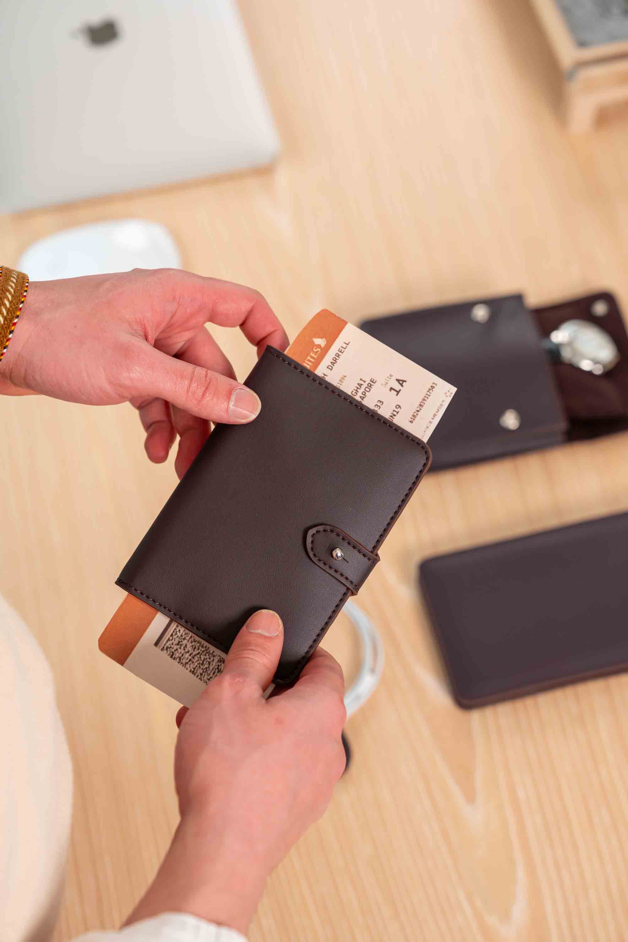 Stylish deep plum vegan leather passport holder with a sleek, minimal design.