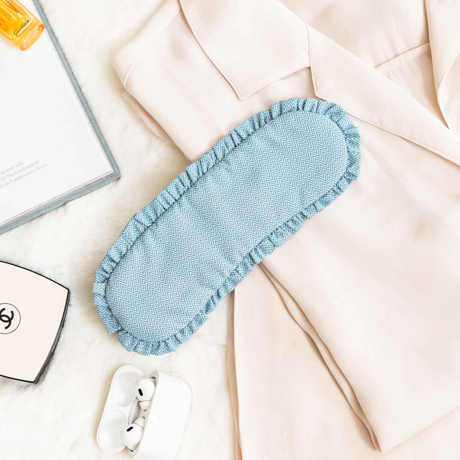 Stylish green vegan leather sleep mask provides modern design and night-time comfort.